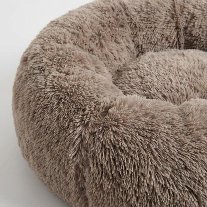 Close-up of the CozyNest Cuddler Dog Bed's plush raised rim texture